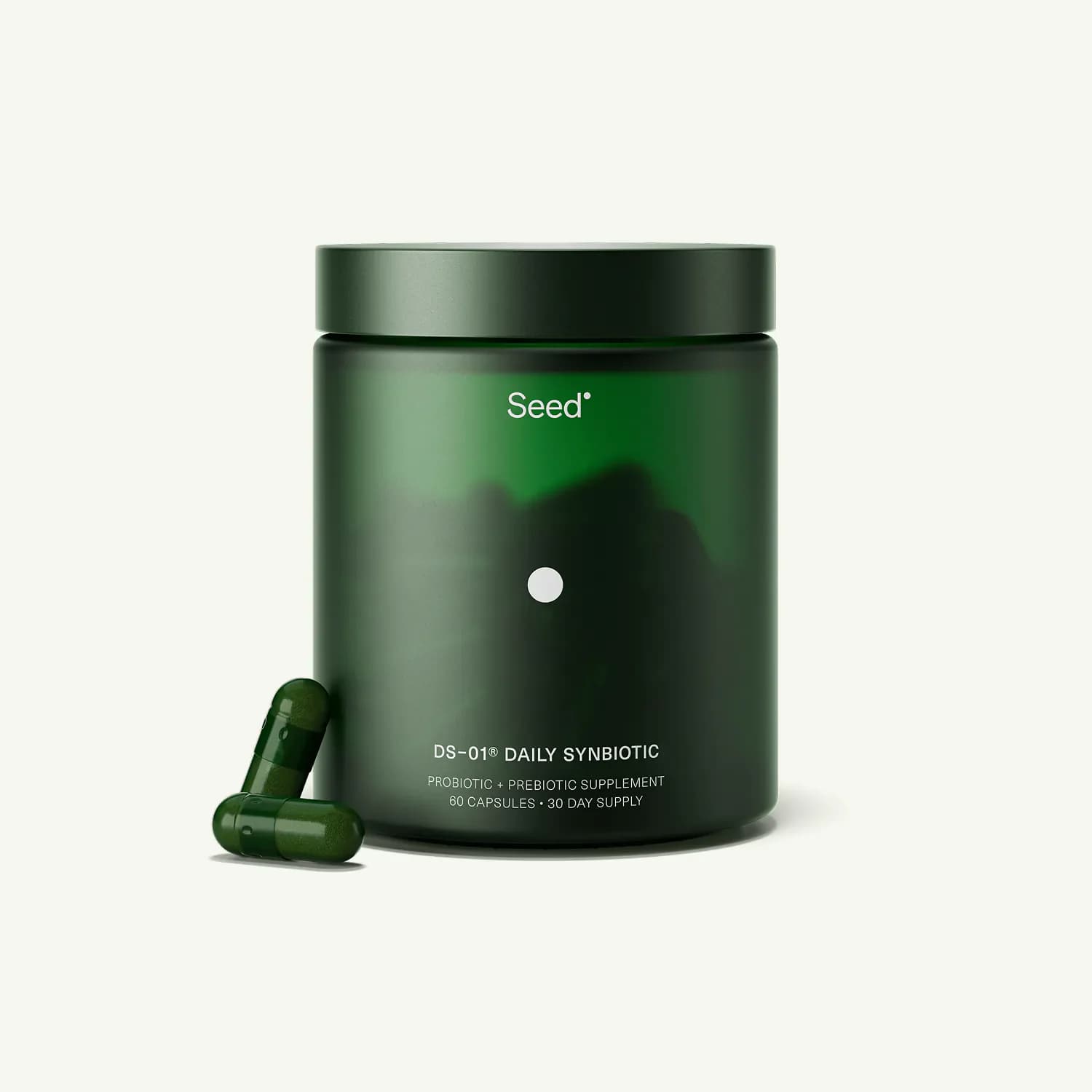 Seed DS-01 Daily Synbiotic green glass jar with two capsules